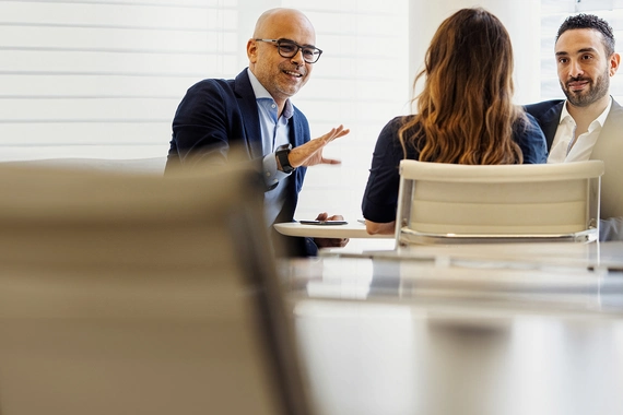 Man and woman behind computer