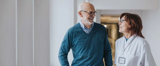 Doctor and patient talking in hallway