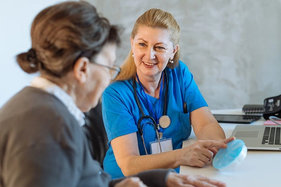 Doctor with senior woman in an office