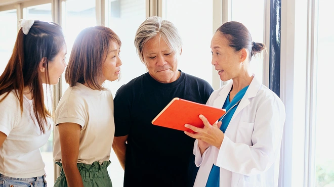 Japanese doctor and patients discussing illness