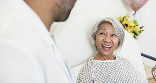 Patient smiling at doctor image