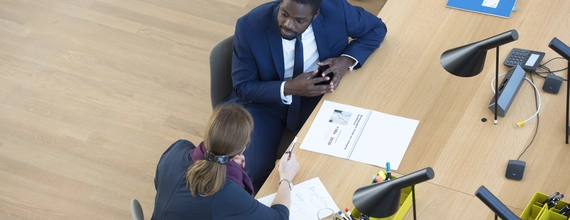 Woman and man sitting at desk