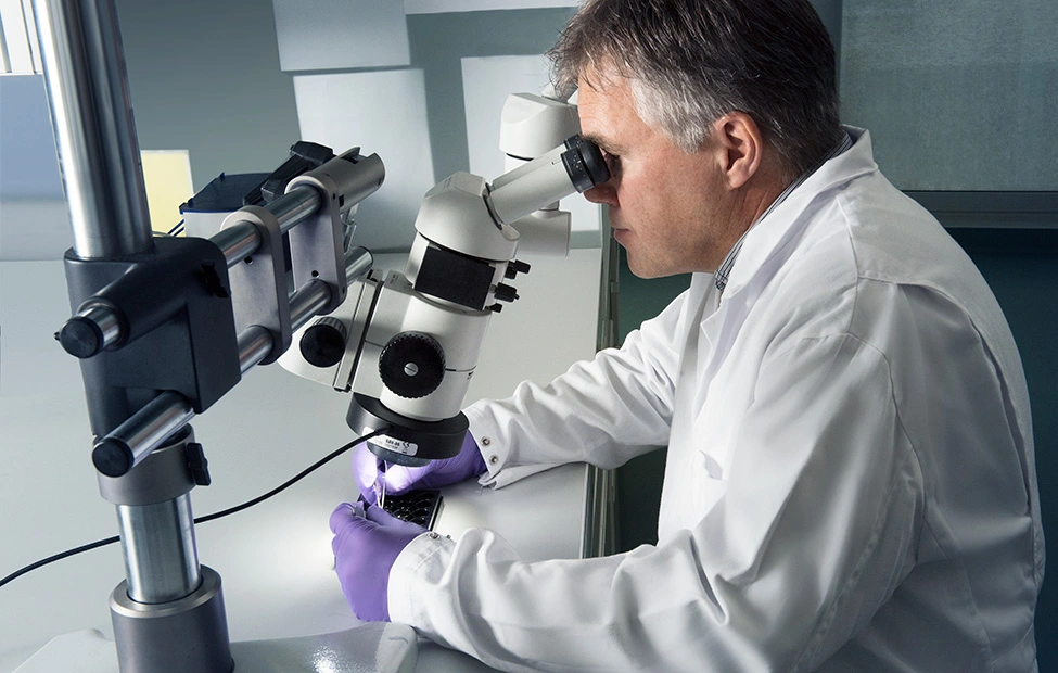 Scientist with microscope