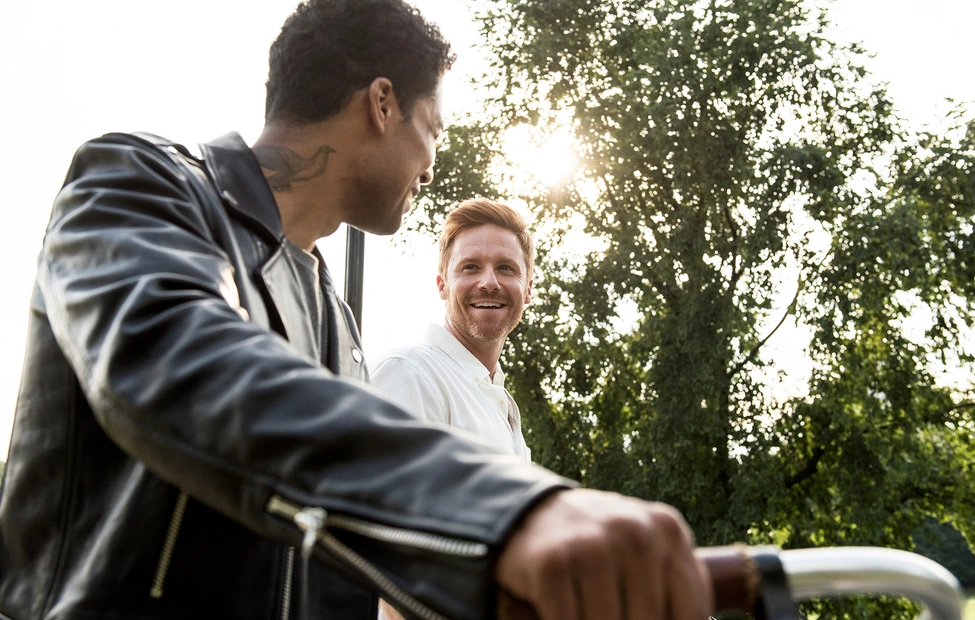 Two men discussion at sunset